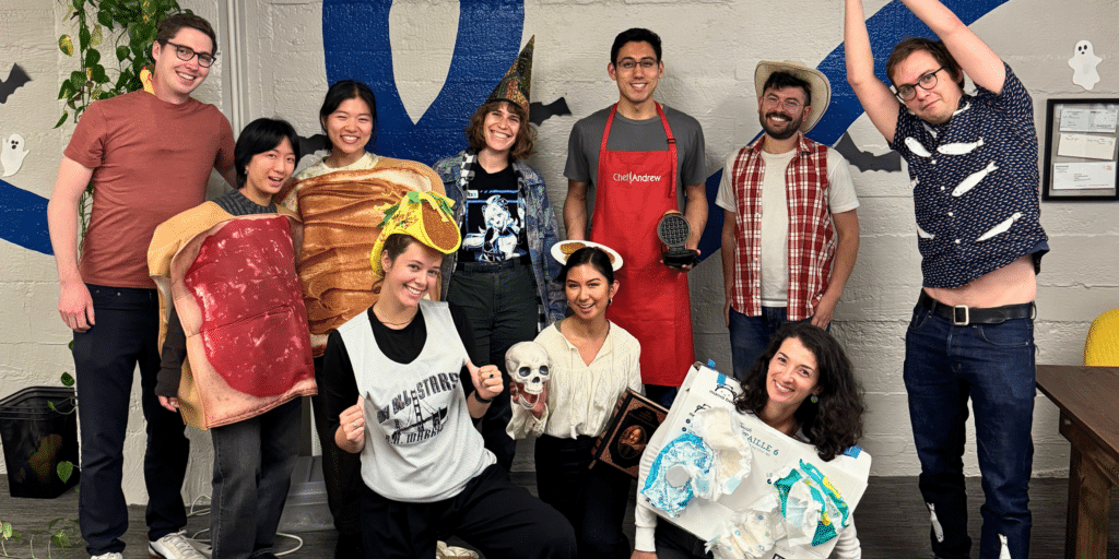 Pavilion employees pose for a photo, dressed in Halloween costumes inspired by the problems they help solve in cities across the US.